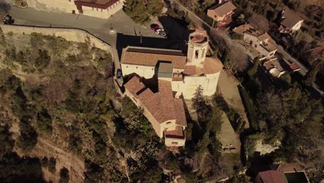 drone orbiting around church of santa maría in san martin sarroca, catalonia