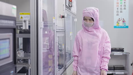 scientist engineer expert observing and checking new prototype machine equipment in research center