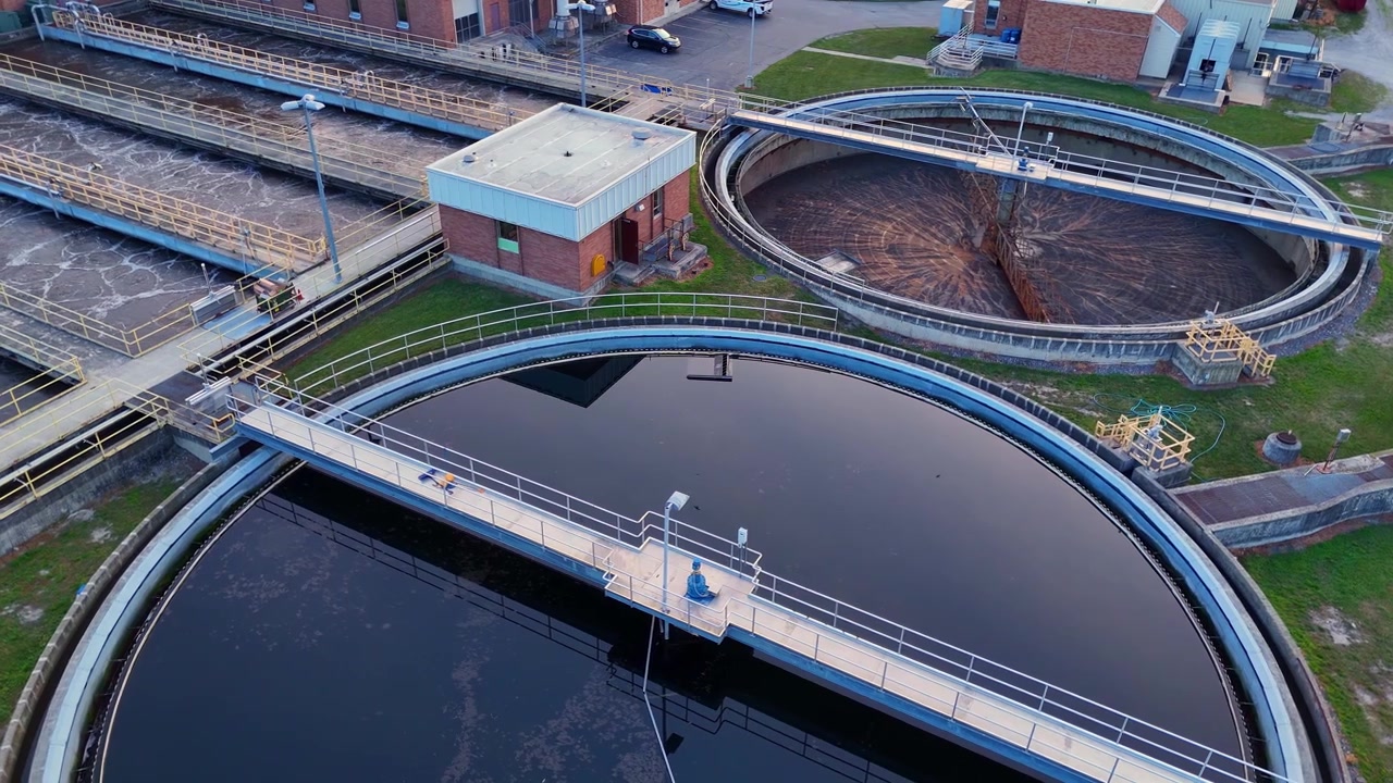 Water treatment plant purifying wastewater in large circular sedimentation tanks in Monroe Water Treatment facility in Michigan