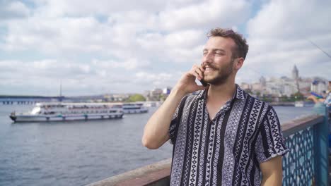 the young man in istanbul speaks on the phone.