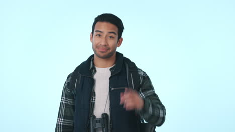 pointing, love and face of a man on a studio