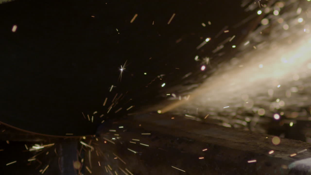 A saw blade cutting through steel and making sparks fly