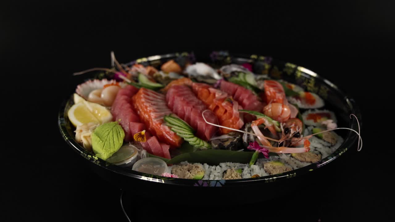Various sushi pieces arranged on a rotating platter