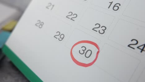 calendar marked with red circle on date 30