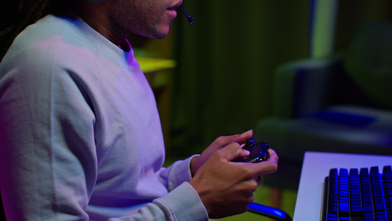 A gamer playing a video game on his PC.