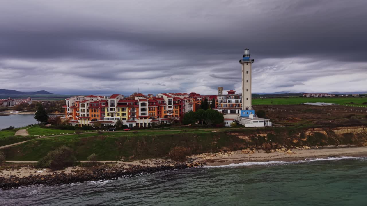 Stunning coastal view of a lighthouse and colorful buildings in Bulgaria