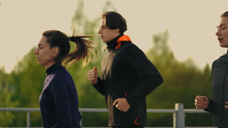 young friends are jogging together in summer morning healthy lifestyle of modern young persons