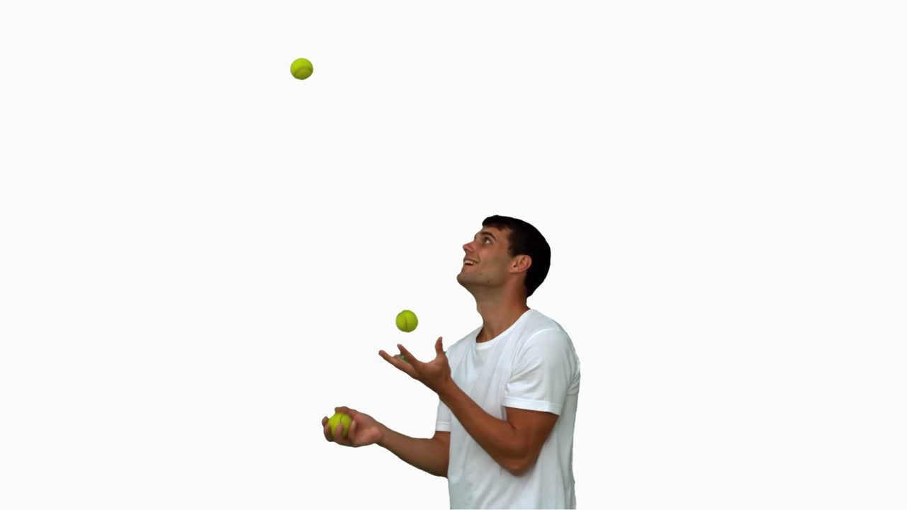 Man dribbling with balls on white screen