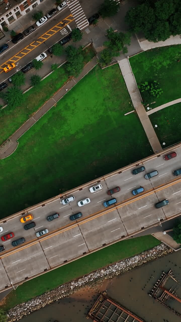 View of the two-way road with multiple cars moving by. One of the highways in New York from top. Vertical video
