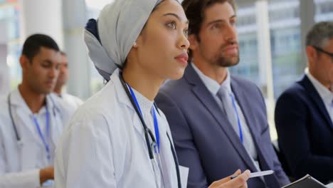 Female-doctor-holding-a-digital-tablet-in-the-business-seminar-4k