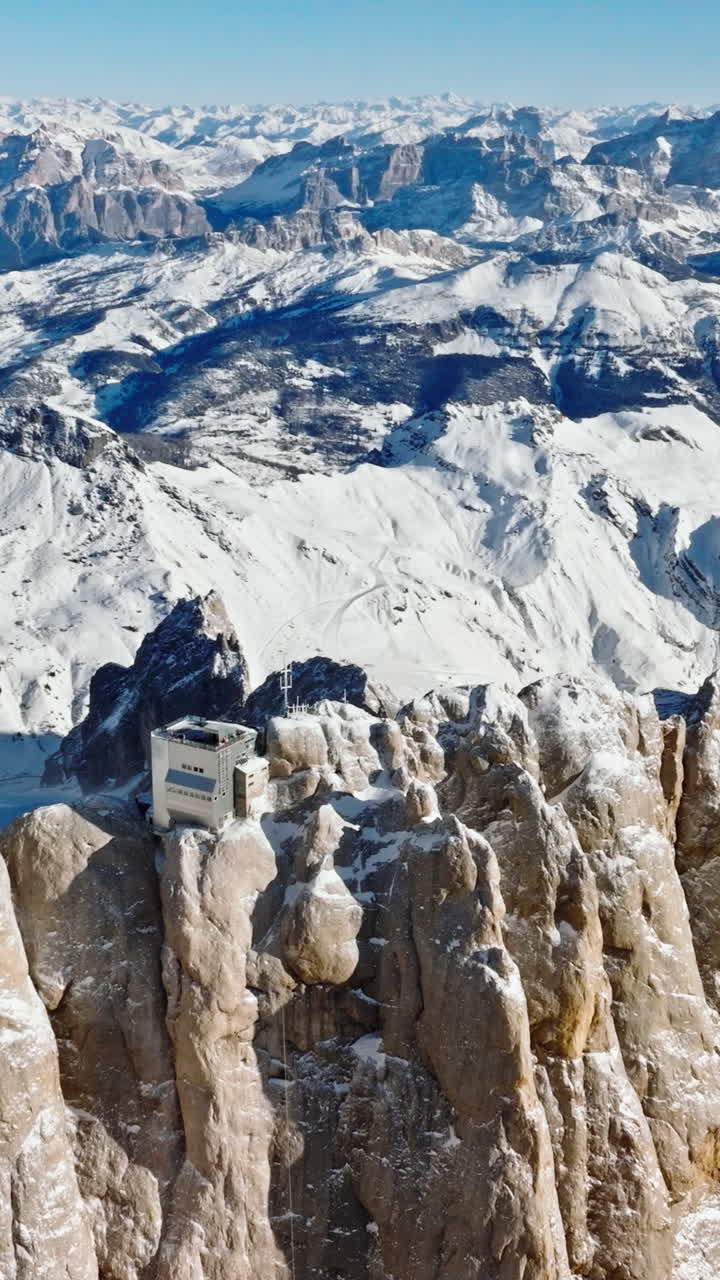 Aerial drone view of the Marmolada mountain in the Dolomites, northeastern Italy. Vertical