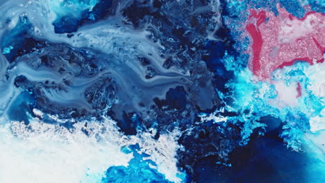 swirling blue and red ink merging in water, abstract art look, vibrant colors, top view