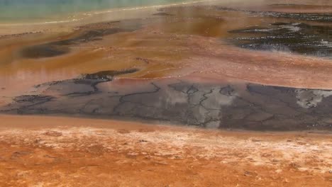 steam rises from a geothermal lake at the grand prismatic springs in florida 1