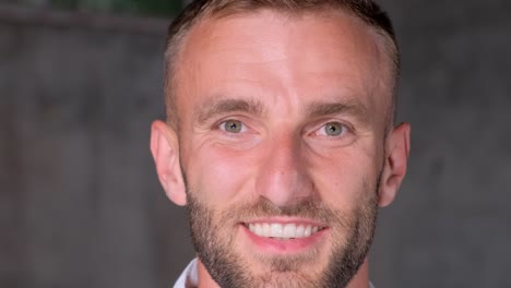 closeup portrait of a handsome brutal man with a beard looking at the camera and smiling closeup portrait of a handsome brutal man with a beard looking at the camera and smiling happy person