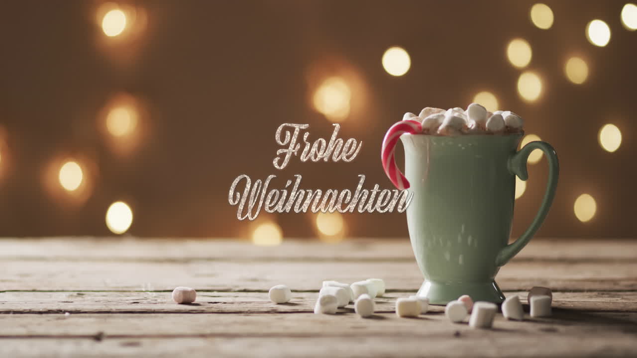 animación de texto de frohe weihnachten sobre taza de chocolate con malvaviscos y manchas de luz