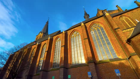 side of historic catholic church of german village straelen in winter sunlight