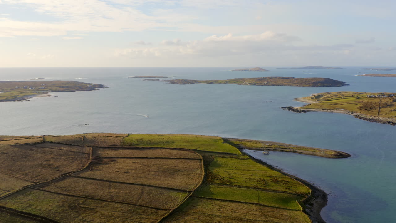 Reverse aerial dolly over rural islands in Clifden Bay, Connemara, Ireland