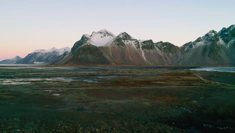 Aerial-view-towards-Vestrahorn-Mountain-across-Stokksnes-beach-at-low-tide,-Iceland