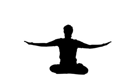 silhouette of woman doing yoga