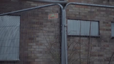 dangerous building after fire surrounded by fencing