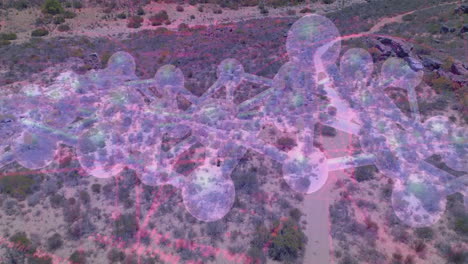 3d network of translucent spheres linking through thin rods hovering over desert with pink grid