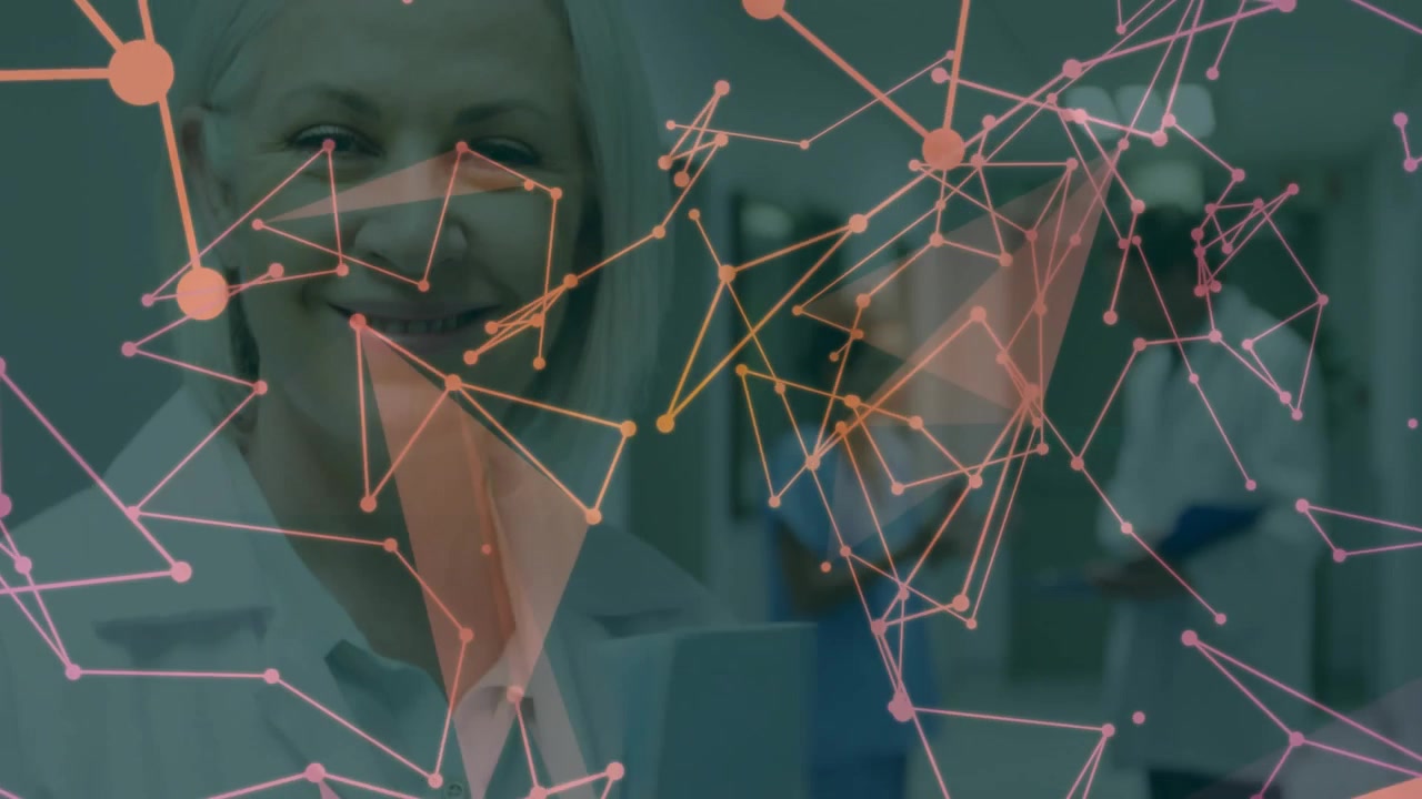 Nurse handing chart to doctor in corridor, pink orange network overlaying as she reviewing charts