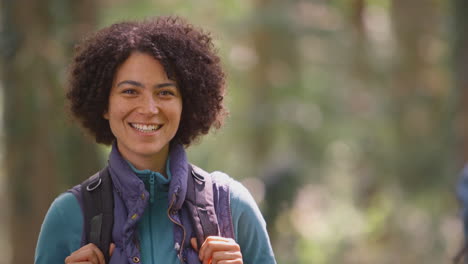 Portrait-Of-Woman-On-Camping-Holiday-Hiking-In-Woods