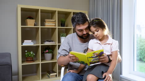 father and daughter in the living room.