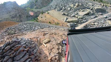 pov from roof of 4wd vehicle following another through the black bear pass in the san juan mountains near telluride colorado