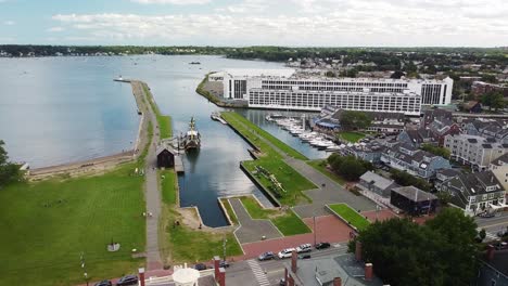 a drone pulls back over salem's harbor, revealing historic, commercial and residential locations