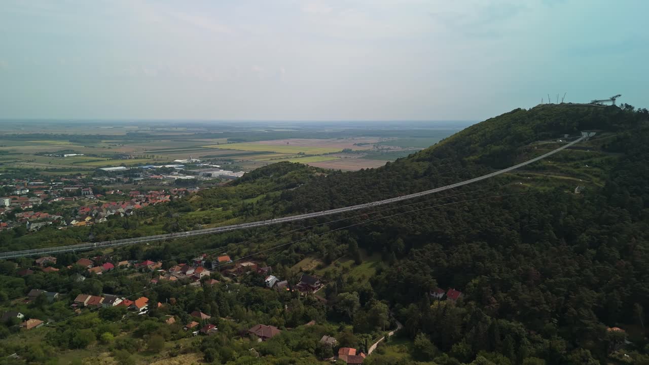 Aerial panning view from the Bridge of National Unity with Sátoraljaújhely suburb in the background in Hungary