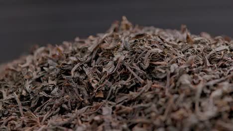 looped spinning dry black tea full frame close-up background