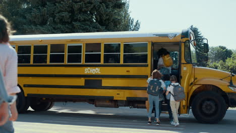 group students running boarding schoolbus. pupils rushing to public shuttle.