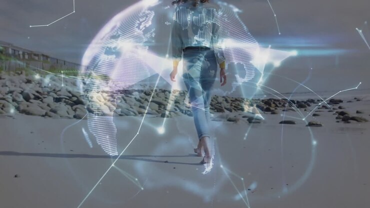 Går på stranden, person med digital globus og animeret overlay.