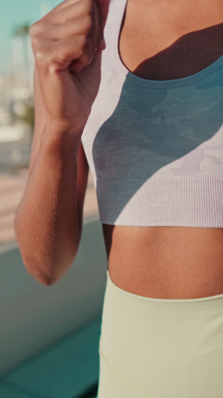 Close-up of Woman Running Outdoors in Athletic Wear