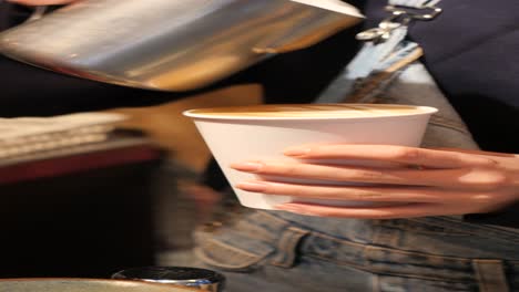 barista pouring latte art