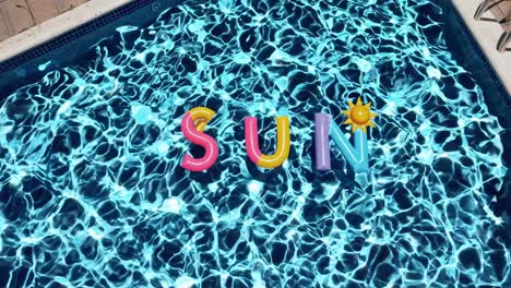opblaasbare letters die 'zon' spellen in een zwembad