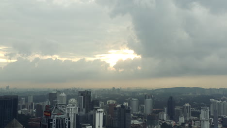 cloudy sky over kuala lumpur city skyline,malaysia,skyscrapers,aerial