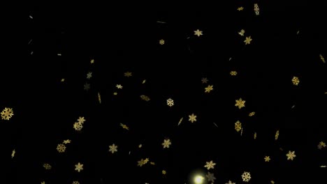 Animation-of-gold-christmas-snowflakes-falling-on-black-background