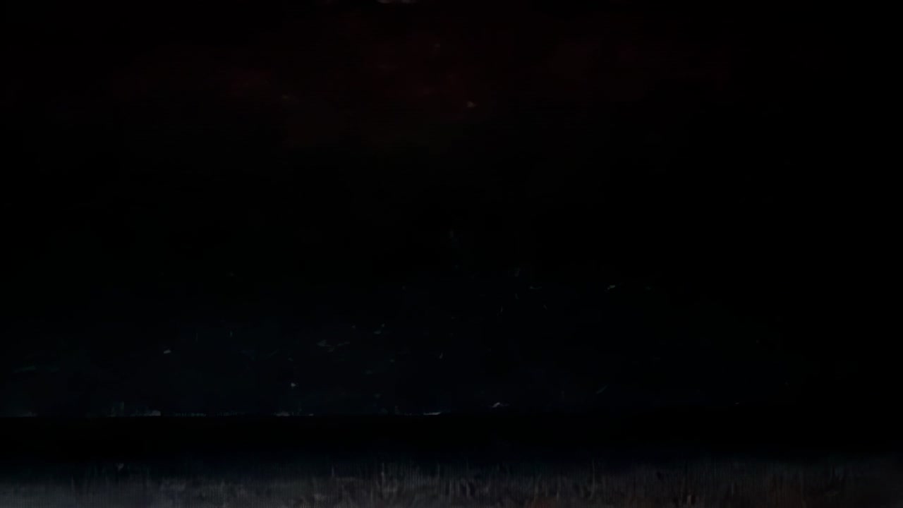 Displaying glitch sequence shifting grey-blue stripe on noise field, flickering red speckles