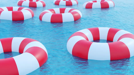 salvavidas rojas y blancas flotando en el agua