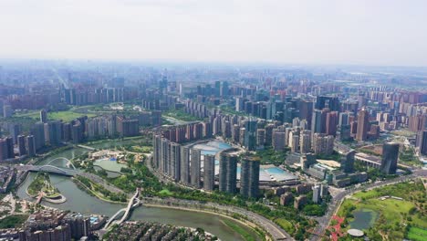 wide drone shot of the tianfu new area cityscape during the day in chengdu, sichuan, china