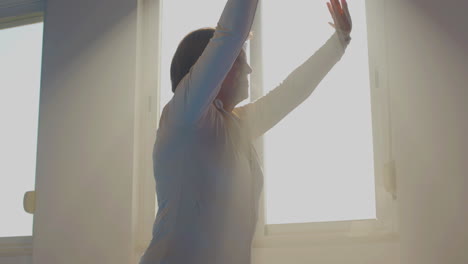 Senior-woman-practicing-tai-chi-in-gym