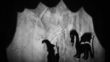 shadow puppets of a witch and dragon