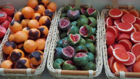 colorful fruit-shaped candies in baskets