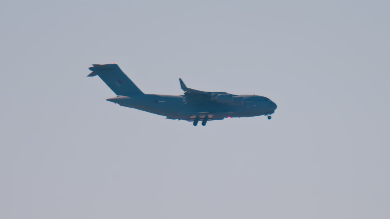 Antibes, France - April 5, 2025: Blurred view of an airplane flying in the cloudy sky