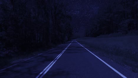 rear facing night driving point of view pov for interior car scene green screen replacement - night footage under a clear starry sky, on quiet deserted outback roads, with brooding trees either side