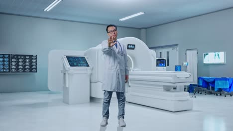 full body of asian male doctor making stop gesture while standing with mri machine in the hospital