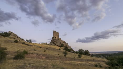 Hill-with-castle-against-cloudy-sky