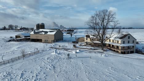 aerial rising shot of an amish farm property